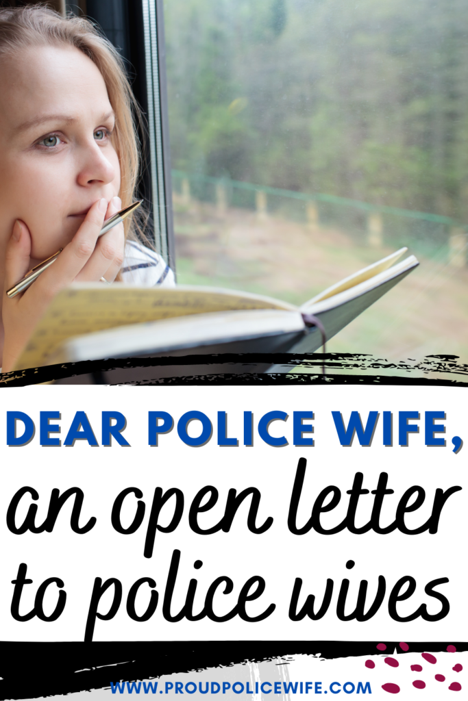 woman writing a letter on a train