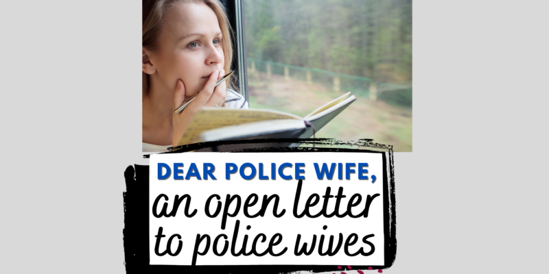 woman writing letter on a train