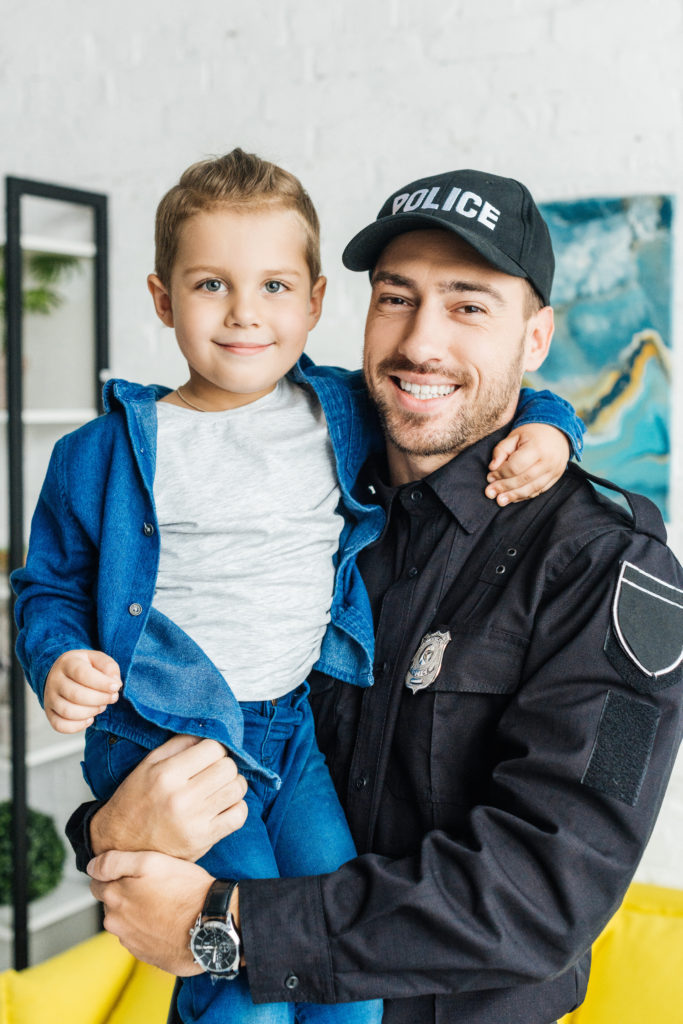 police officer holding child